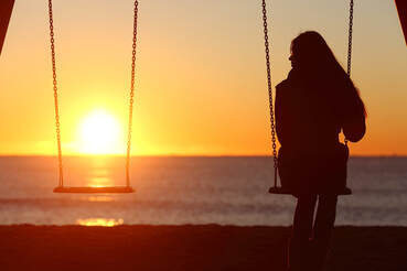 Woman alone on a swing looking at the sunset. Coping with infidelity can be hard for both people in a relationship. Sex therapy in Plymouth, MN can also include couples therapy for infidelity in Plymouth, MN. Online therapy in Minnesota can help you today!