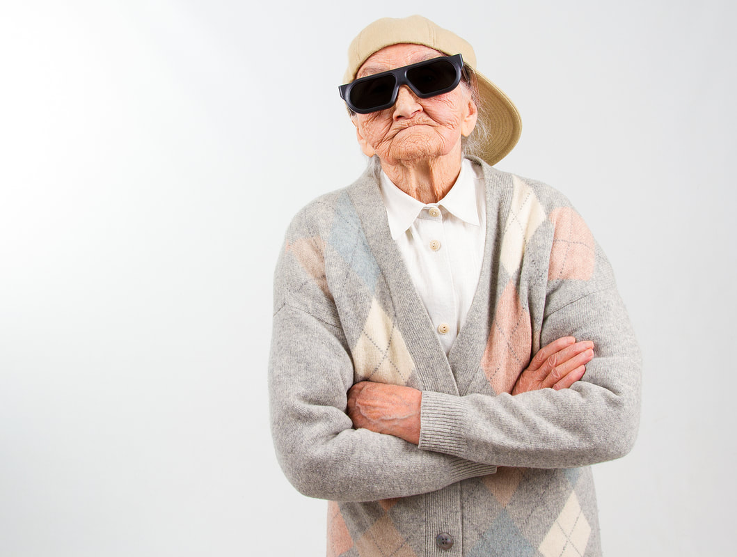Picture of a grandma wearing a baseball cap and sunglasses with arms crossed. Get actual tips for lasting longer in bed with this post from an online sex therapist in Minnesota, from this Plymouth, MN based sex therapy clinic.