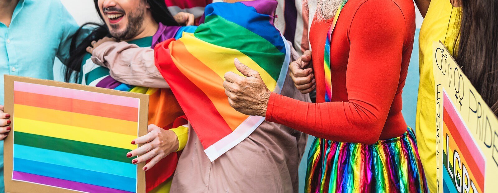 Picture of individuals in a group at a PRIDE parade for advancement of LGBTQ rights. Affirming therapists in Plymouth, MN can help via online therapy in Minnesota for LGBTQ+ individuals and couples. 55369 | 55361 | 55391