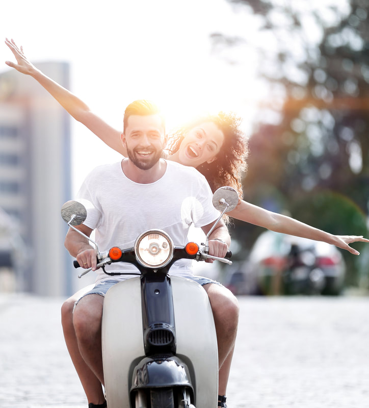 Photo of couple on motorcycle looking happy with woman's arms extended. Sex Therapy in Plymouth, MN can help you feel more confident about your sex life. Sexual Wellness Institute near Minneapolis area has sex therapists to help. Get online therapy in Minnesota here! Plymouth, MN 55446