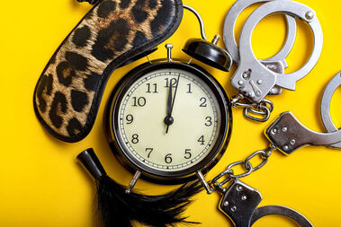 Picture of mask, timer, handcuffs and other sex toys on a yellow background. A Plymouth, MN sex therapist can help you spice things up in the bedroom, while providing sex therapy for couples via online therapy in Minnesota and beyond.