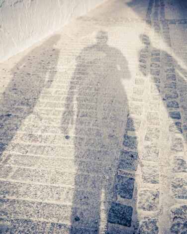 Picture of three shadows in the street to discuss ENM or ethical non monogamy and consensual non monogamy with an online sex therapist in Plymouth, MN. If you're looking for a sex therapist near the Twin Cities, consider online therapy in Minnesota! Especially zip codes 55369 | 55361 | 55391