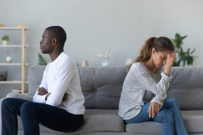 Couples therapy for infidelity in Plymouth, MN can help this couple in crisis after an affair. Two adults are facing away from each other, not communicating. Marriage and family therapists at Sexual Wellness Institute can help in online therapy in Minnesota too!