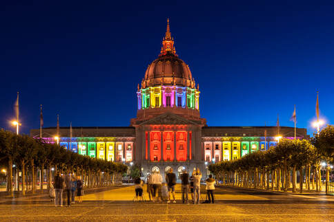 Picture of rainbow lights covering the capitol building to advocate for the advancement of LGBTQ rights. Affirming therapists in Plymouth, MN can help via online therapy in Minnesota for LGBTQ+ individuals and couples. 55447 | 55441 | 55442
