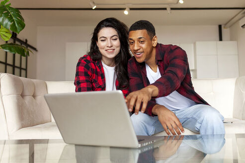 Picture of a young multiracial couple researching online sex therapy in Minnesota with an online sex therapist near them in Plymouth, MN, the Twin Cities, Minneapolis, MN, and elsewhere in the state of Minnesota. 55369 | 55361 | 55391